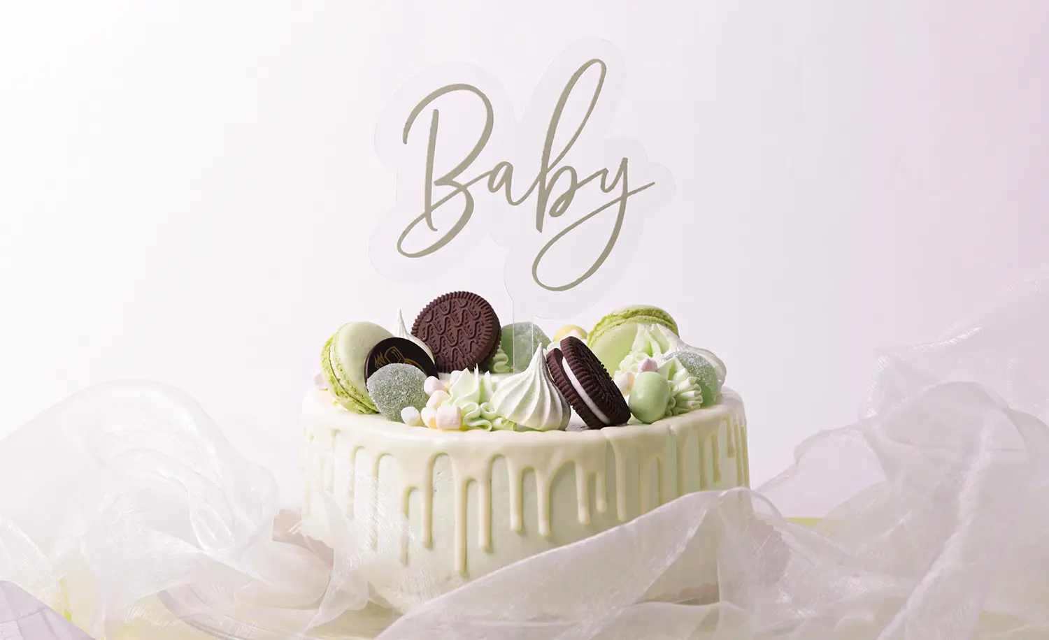 Baby - kyltillä koristeltu vaaleanvihreä täytekakku
